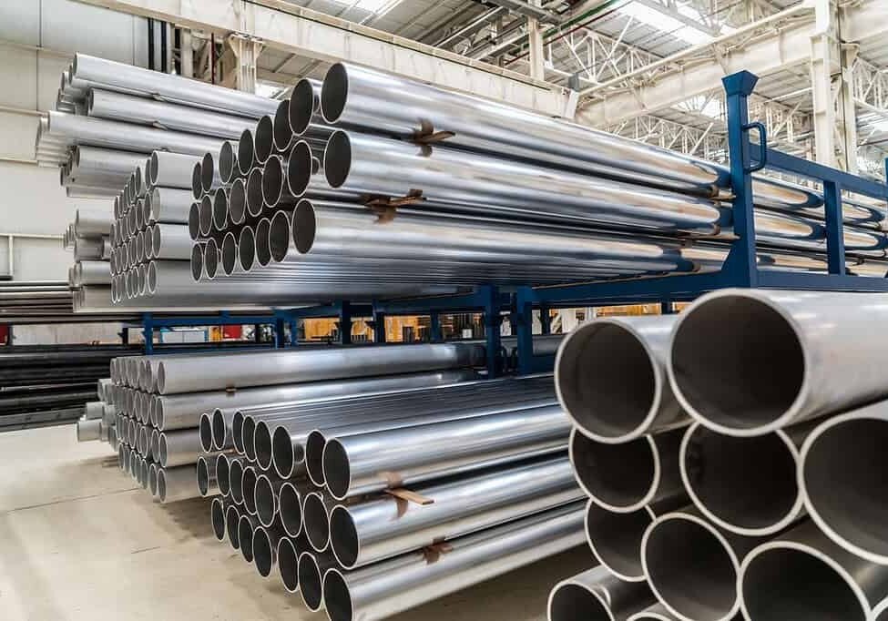 racks of aluminium pipes in a warehouse